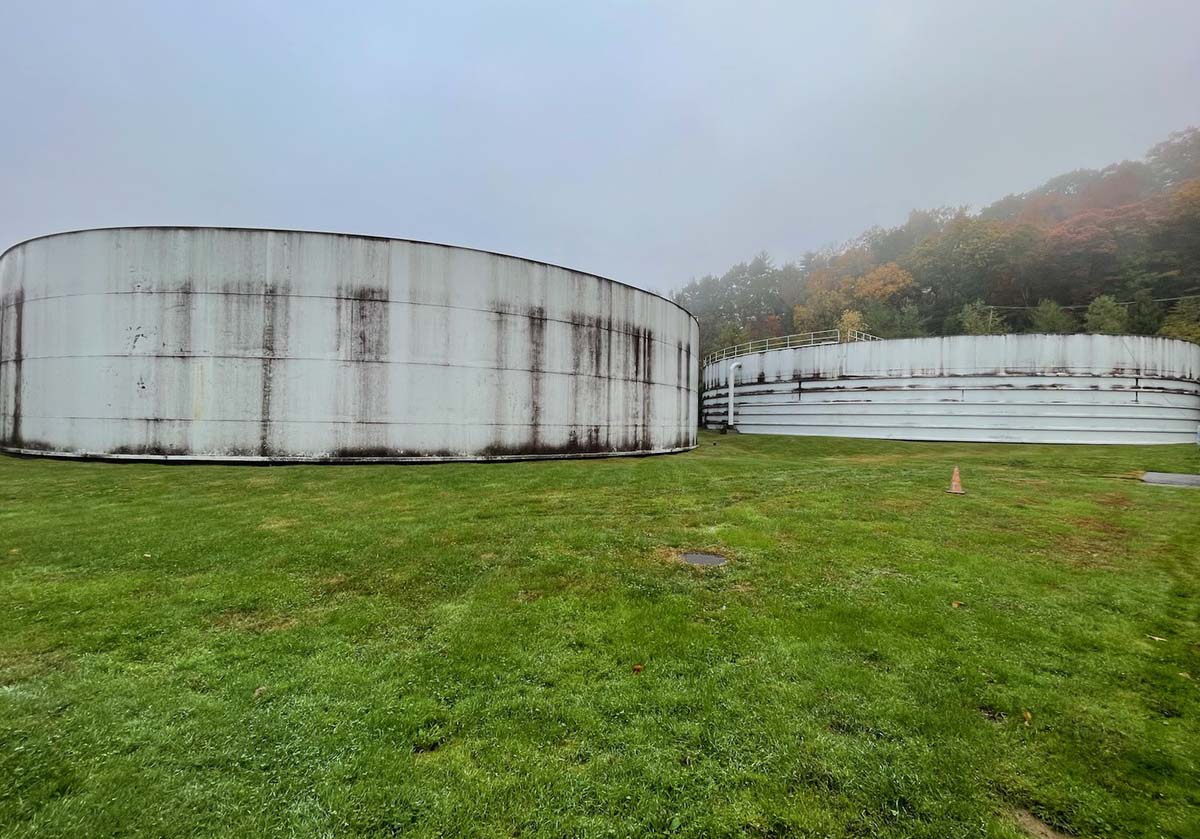 before a large tank is cleaned, it is covered in dirt and grime