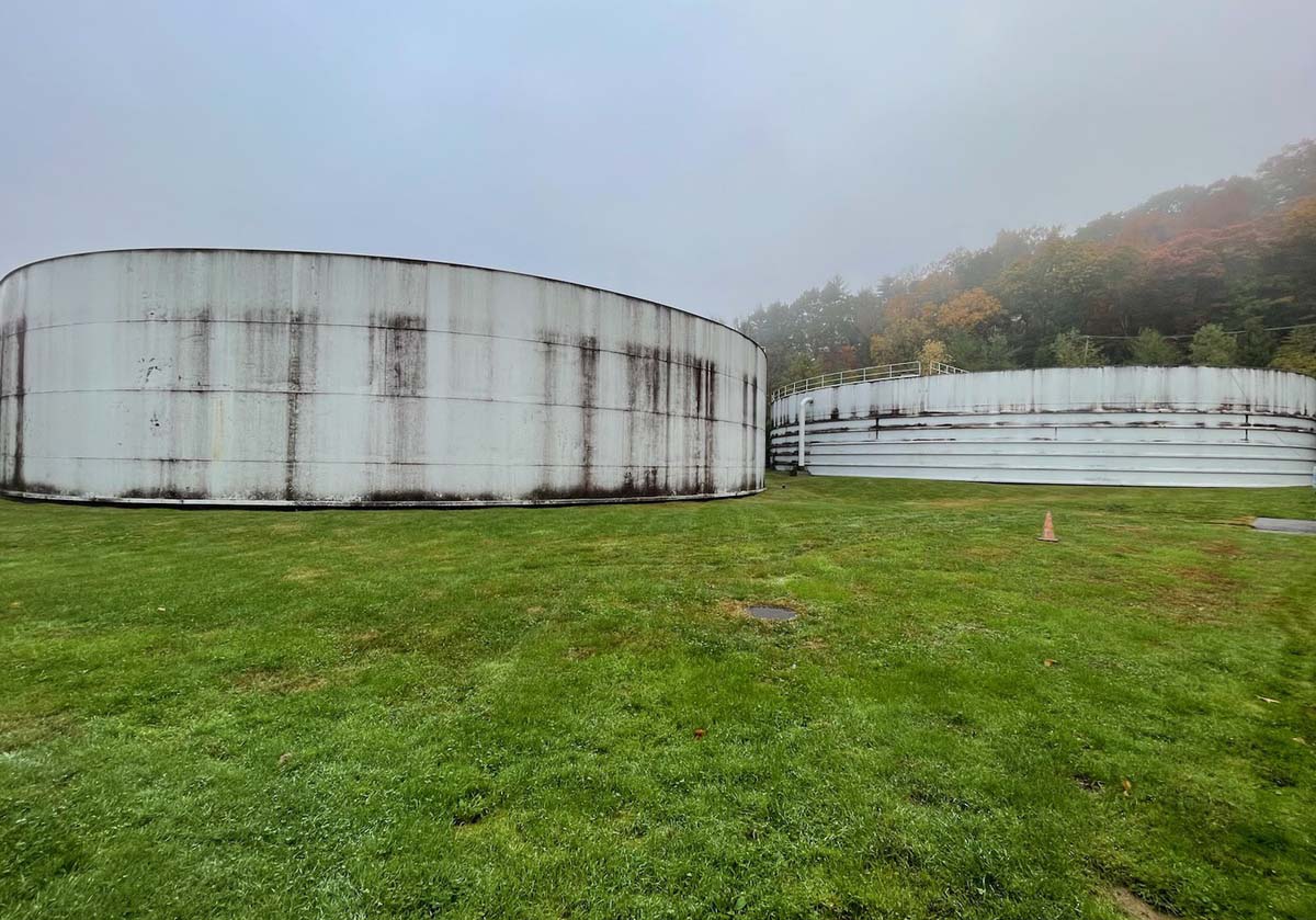 before a large tank is cleaned, it is covered in dirt and grime