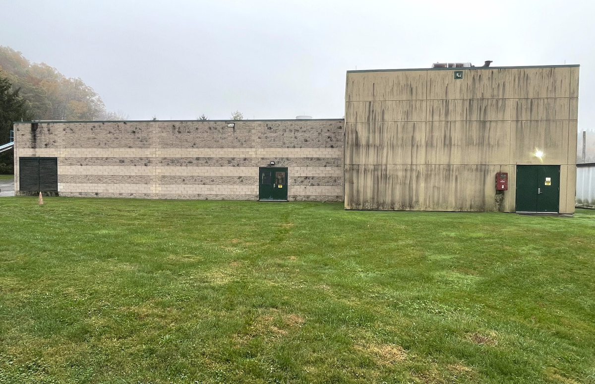 whole outside exterior of a building that is covered in dirt